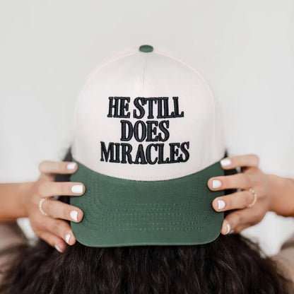 He Still Does Miracles Trucker Hat