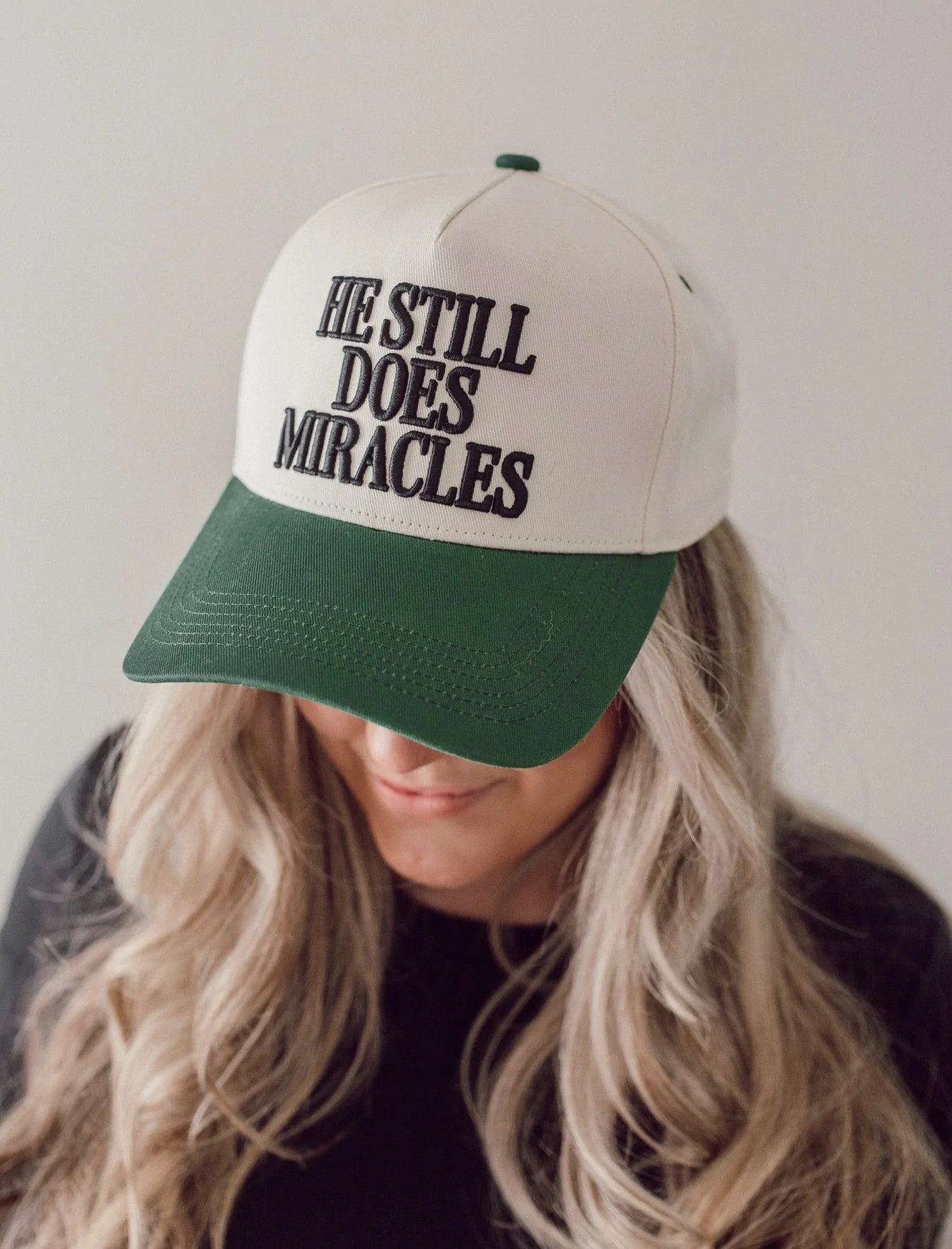 He Still Does Miracles Trucker Hat